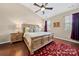 Spacious main bedroom with high ceilings, ceiling fan, and large bed at 7130 Maricopa Rd, Charlotte, NC 28277