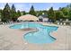 The neighborhood swimming pool has lounge chairs, tables, and a shade structure plus a pool house with picnic tables nearby at 7130 Maricopa Rd, Charlotte, NC 28277