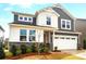 Beautiful two-story home with a two-car garage and professionally landscaped yard at 9930 Cask Way, Huntersville, NC 28078