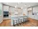 Modern kitchen featuring an island with barstool seating and stainless steel appliances at 9930 Cask Way, Huntersville, NC 28078