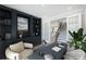 Office space featuring built-in bookshelves, a large desk, and lots of natural lighting at 9957 Cask Way, Huntersville, NC 28078