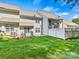Beautiful backyard featuring green grass, privacy fence, and well maintained siding at 10063 Reindeer Way Ln, Charlotte, NC 28216