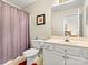 Cozy bathroom featuring neutral colors, a single sink vanity, and a shower/tub combo at 10063 Reindeer Way Ln, Charlotte, NC 28216