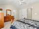 Comfortable bedroom with vaulted ceiling, dresser, carpet, and ensuite bathroom access at 10063 Reindeer Way Ln, Charlotte, NC 28216