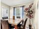 Bright dining room featuring modern furniture, neutral wall paint, and natural light from the window at 10063 Reindeer Way Ln, Charlotte, NC 28216