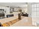 Open layout dining room offering sleek table, kitchen view, and a door to an outdoor area at 10063 Reindeer Way Ln, Charlotte, NC 28216