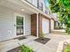 Charming townhouse featuring brick accents, and an inviting front entrance at 10063 Reindeer Way Ln, Charlotte, NC 28216