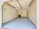Clean garage with painted floors, offering ample space for parking and storage at 10063 Reindeer Way Ln, Charlotte, NC 28216