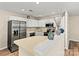 Bright eat-in kitchen featuring stainless steel appliances, ample white cabinetry, and stylish countertops at 10063 Reindeer Way Ln, Charlotte, NC 28216