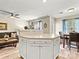 Open concept living area with kitchen, modern ceiling fan, a dining area, and comfortable furniture at 10063 Reindeer Way Ln, Charlotte, NC 28216