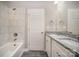 Modern bathroom with double sinks, granite countertops, and marble-tiled shower at 1102 Grady St, Salisbury, NC 28144