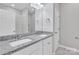 Modern bathroom features double vanity with granite countertop and tiled shower at 1102 Grady St, Salisbury, NC 28144