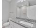 Bright bathroom features a granite vanity and white fixtures at 1102 Grady St, Salisbury, NC 28144