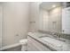 Bright bathroom with marble-like countertop, shower and commode with a sleek mirror at 1102 Grady St, Salisbury, NC 28144
