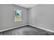Bedroom featuring hardwood flooring and a window with views of the property at 1102 Grady St, Salisbury, NC 28144