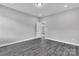 Spacious bedroom with gray walls and gray hardwood flooring, complemented by recessed lighting at 1102 Grady St, Salisbury, NC 28144