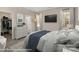 Stylized bedroom featuring a large TV screen, a floor lamp, and a walk-in closet at 1102 Grady St, Salisbury, NC 28144