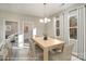 Dining room with modern chandelier, neutral tones and lots of natural light at 1102 Grady St, Salisbury, NC 28144