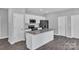 Functional kitchen with stainless steel appliances, granite countertops, and white cabinets at 1102 Grady St, Salisbury, NC 28144