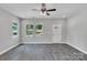 Spacious living room featuring luxury vinyl plank floors, large windows, and a front door at 1102 Grady St, Salisbury, NC 28144