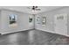 Cozy living area featuring three windows, neutral walls, and vinyl flooring at 1102 Grady St, Salisbury, NC 28144