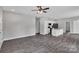 Open-concept living room and kitchen with sleek appliances, an island, and modern fixtures at 1102 Grady St, Salisbury, NC 28144