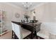 Elegant dining room with chandelier, large window, and stylish table setting at 1306 San Gabriel Ave, Charlotte, NC 28214