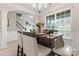 Elegant dining room with chandelier, large window, and stylish table setting at 1306 San Gabriel Ave, Charlotte, NC 28214