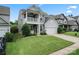 Charming two-story home with a welcoming front porch and attached two-car garage at 1306 San Gabriel Ave, Charlotte, NC 28214