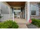 Inviting front porch with rocking chairs, stone accents, and a 'Welcome' sign at 1306 San Gabriel Ave, Charlotte, NC 28214