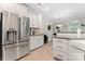 Modern kitchen featuring stainless steel appliances, white cabinetry, and sleek countertops at 1306 San Gabriel Ave, Charlotte, NC 28214