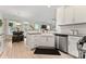 Well-lit kitchen showcasing modern appliances, cabinetry, and a view into the living space at 1306 San Gabriel Ave, Charlotte, NC 28214