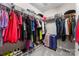 Tidy walk-in closet with ample hanging storage, shelves, and convenient shoe organizers for optimized organization at 1306 San Gabriel Ave, Charlotte, NC 28214
