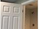 Bathroom with a white door and a marble tile stand up shower at 148 Forest Heights Dr, Mcadenville, NC 28101