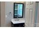 Bathroom featuring dark vanity with mirror and natural light at 148 Forest Heights Dr, Mcadenville, NC 28101
