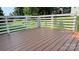 A wooden deck with white railings overlooking the yard and trees at 148 Forest Heights Dr, Mcadenville, NC 28101