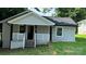 Charming front of house featuring a cozy porch with black posts and white railings at 148 Forest Heights Dr, Mcadenville, NC 28101