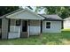 Charming front of house featuring a cozy porch with black posts and white railings at 148 Forest Heights Dr, Mcadenville, NC 28101