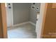 A neutral colored laundry room featuring a utility sink and washer/dryer hookups at 148 Forest Heights Dr, Mcadenville, NC 28101