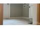 A neutral laundry room featuring washer/dryer hook ups, tile floors, and a door at 148 Forest Heights Dr, Mcadenville, NC 28101