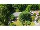 Aerial view of home surrounded by lush trees, offering privacy and tranquility at 155 Springdale Acres Dr, Mooresville, NC 28115
