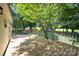 Wooden back deck surrounded by mature trees, creating a shady and private outdoor space at 155 Springdale Acres Dr, Mooresville, NC 28115