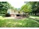 Exterior back of the house showing deck, yard, and foundation at 155 Springdale Acres Dr, Mooresville, NC 28115