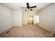 Spacious carpeted bedroom that leads to the ensuite bathroom at 155 Springdale Acres Dr, Mooresville, NC 28115