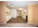 Well-lit kitchen with wood-look floors and white cabinets and countertops for a bright look at 155 Springdale Acres Dr, Mooresville, NC 28115