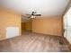 Large living room with ceiling fan and lots of space, ready for your personal touch at 155 Springdale Acres Dr, Mooresville, NC 28115