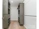 This walk-in closet features custom gray shelving units, offering ample storage space at 1632 Charles Raper Jonas Hwy, Mount Holly, NC 28120