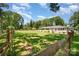 Spacious front yard enclosed by wooden fencing, showcasing the property's generous lot size at 1632 Charles Raper Jonas Hwy, Mount Holly, NC 28120