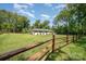 A sprawling front yard with a charming fence, offering privacy and curb appeal at 1632 Charles Raper Jonas Hwy, Mount Holly, NC 28120