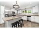 Stylish kitchen with stainless steel appliances, granite countertops, and a practical island with black stools at 1632 Charles Raper Jonas Hwy, Mount Holly, NC 28120